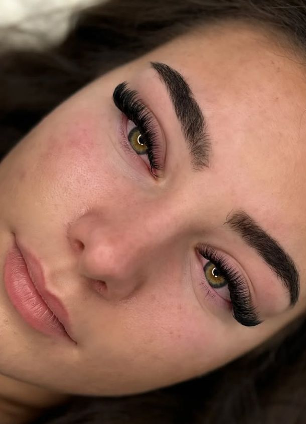 Volume lash extensions with shaped brows close-up